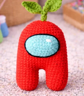 Red Among Us crochet pattern amigurumi with green leaf sprout hat