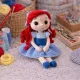 Little Mermaid crochet amigurumi doll with red curly hair and blue dress