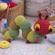 Caterpillar crochet pattern amigurumi with red head and green body segments